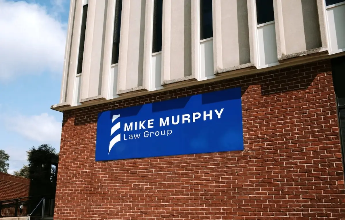 The Mike Murphy Law Group sign on the brick wall of an office building