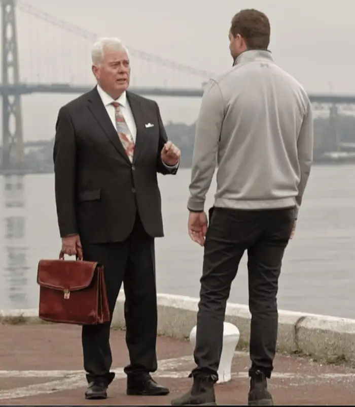 Michael Murphy, K.C. with a client by Halifax harbour