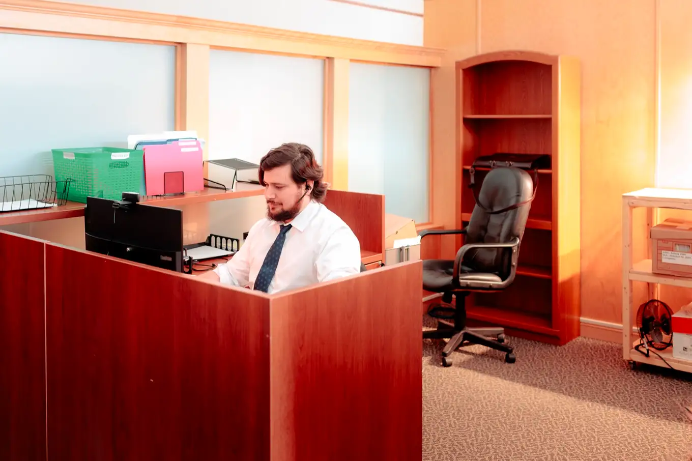 Westin Hebert at his desk in the firm's Moncton office